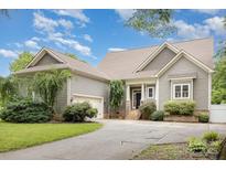 Charming home featuring a brick walkway, meticulously landscaped front yard, and neutral exterior at 187 Spring Run Dr, Mooresville, NC 28117