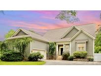 Charming home with inviting entrance, lush landscaping, and attached garage at 187 Spring Run Dr, Mooresville, NC 28117