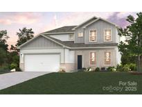 Charming new construction two-story home with gray and white accents, lush yard, and two-car garage at 21013 Running Creek Dr # 4, Locust, NC 28097