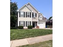 Charming two-story home with a well-manicured lawn and attached garage at 418 Eastway Sw Ln, Conover, NC 28613