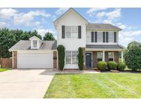 Charming two-story home with a well-maintained lawn and a two-car garage at 600 Capella Ct, Gastonia, NC 28056
