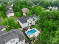 Stunning aerial view of home with backyard pool and lush landscaping in established neighborhood at 10304 Squires Way # 18, Cornelius, NC 28031