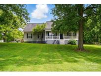 Charming single-story home with well-manicured lawn and inviting front porch at 1621 California Rd, York, SC 29745