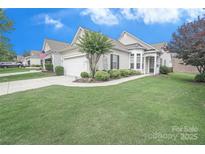 Charming single-story home featuring an attached garage, well-maintained lawn, and classic curb appeal at 19182 Mallard Dr, Fort Mill, SC 29707