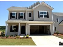 Two-story home features a front-entry garage, black shutters, landscaped yard and neutral-colored siding at 2199 Catawba Trace Dr, Catawba, NC 28609