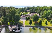 Waterfront property with boat dock on a well manicured lot with mature trees in a peaceful setting at 2354 Valelake Rd, York, SC 29745