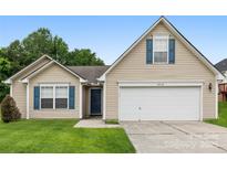 Charming single-Gathering home featuring a two-car garage and a well-manicured lawn at 4714 Adamshire Ave, Concord, NC 28025