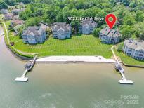 Stunning aerial view of lakefront condos with private beach and lush landscaping at 502 Lake Club Dr, Rock Hill, SC 29732