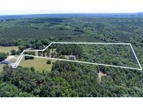 Expansive aerial view showcasing a large parcel of land surrounded by lush greenery and mature trees at 5410 A R Gordon Rd, Waxhaw, NC 28173