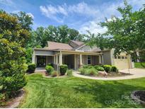 Charming home featuring manicured landscaping, a well-maintained lawn, and inviting curb appeal at 5590 Elk Knob Ct, Denver, NC 28037