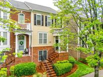 Charming townhome with brick facade, landscaped front yard, and inviting entryway at 815 Granby Dr, Fort Mill, SC 29708