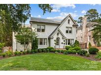 Charming two-story home with manicured landscaping and a well-maintained lawn at 206 Hillside Ave, Charlotte, NC 28209