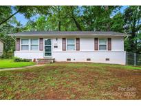 Charming single-story home featuring a brick foundation and well-maintained landscaping at 2328 Danforth Ln, Charlotte, NC 28208