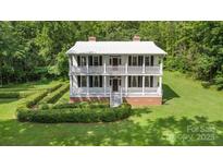 Classic two-story home with a welcoming exterior, manicured grounds, and a well-maintained lawn at 704 Little Creek Dr, Kings Mountain, NC 28086