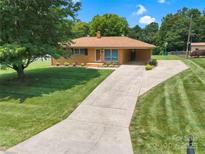 Charming ranch home with well-manicured lawn and long driveway at 888 Stowe Ln, Gastonia, NC 28056