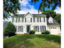 Charming two-story home features black shutters, a manicured lawn, and a classic design at 9146 Austin Ridge Ln, Charlotte, NC 28214