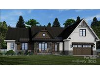 A charming single-Gathering home featuring stone accents, a welcoming porch, and an attached two-car garage at 1676 Parkside Dr, Catawba, NC 28609