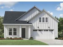Charming new construction home featuring white vertical siding, a dark roof, a two-car garage, and professional landscaping at 4146 Eastover Glen Rd # 0322, Charlotte, NC 28269