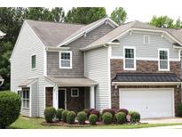 Charming two-story home with stone accents, neutral siding, and a well-maintained front yard at 10726 Greenhead View Rd, Charlotte, NC 28262