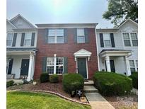 Charming brick townhome featuring neat landscaping and a welcoming entrance, perfect for curb appeal at 12564 Jessica Pl, Charlotte, NC 28269