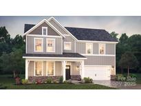 Charming two-story home with gray siding, stone accents, and a welcoming covered front porch at 264 Miramar Dr, York, SC 29745