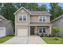 Charming two-story home with a well-maintained lawn and inviting front porch at 3951 Tersk Dr, Midland, NC 28107