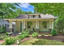 Charming home exterior with craftsman style porch, front yard landscaping, and curb appeal at 1417 The Plz, Charlotte, NC 28205
