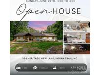 Charming single-story home featuring a lush lawn, natural surroundings, and an inviting open house event at 524 Heritage Vw, Indian Trail, NC 28079