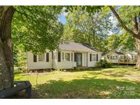 Charming single-story home with mature trees and a well-maintained lawn in a quiet neighborhood at 1072 5Th Ne St, Hickory, NC 28601