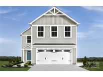 Inviting two-story home with attached garage and manicured landscaping at 1202 Elm Forest Ln, China Grove, NC 28023