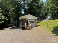 Charming home with a covered porch and a well-maintained yard at 104 Deer Park Rd # D143, Mount Gilead, NC 27306