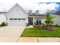 Charming single-story home featuring a well-manicured lawn and attached two-car garage at 25952 Appleyard Ct, Lancaster, SC 29720