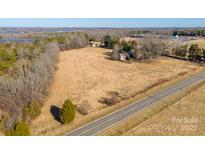 Panoramic aerial view of the property showcasing land, trees, a solar array and the surrounding area at 2808 Water Plant Rd, Maiden, NC 28650