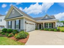 Charming single Gathering home with a manicured lawn and two car garage at 174 Pine Eagle Dr, Rock Hill, SC 29732