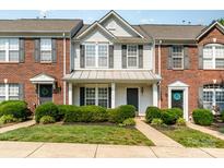 Charming townhome with a manicured lawn and classic architectural details, showcasing a welcoming entrance at 5322 Jocelyn Ln, Charlotte, NC 28269