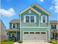 Charming two-story home with a two-car garage, landscaped yard, and a mix of shake and plank siding at 133 Aspire Cir, Wingate, NC 28174