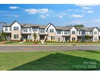 Charming townhome exterior with brick and siding accents, manicured lawn, and inviting curb appeal at 3124 Beacon Heights Rd, Indian Land, SC 29707
