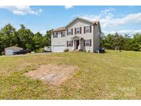 Charming two-story home with vinyl siding, attached garage, and a large, green front yard at 3401 Shillinglaw Rd, Sharon, SC 29742