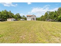 Two-story home on sprawling lawn with vehicles, boats, and recreational equipment at 3401 Shillinglaw Rd, Sharon, SC 29742
