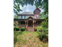 Charming two-story home with a large porch and intricate architectural details at 425 W Horah St, Salisbury, NC 28144