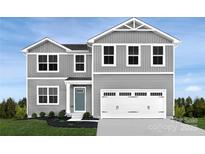Charming two-story home with gray siding, a two-car garage, and a well-manicured lawn at 94 Florentine Way, Charlotte, NC 28214