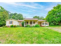 Charming single-story home with a spacious front yard and mature trees at 105 Hopewell Church Rd, Shelby, NC 28152