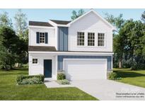 Two-story home features blue and white accents, a two-car garage, and a well-manicured lawn at 146 Astor St, Troutman, NC 28166