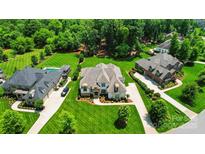Expansive estate featuring pristine landscaping, a pool, and a grand home with a long driveway and ample parking at 300 Wheatberry Hill Dr, Weddington, NC 28104