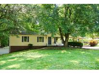 Charming single-story home with a well-maintained lawn and mature trees offering plenty of shade at 3043 Charles Rd, Shelby, NC 28152