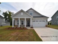 Charming home with a welcoming front porch and attached two-car garage at 4178 Millstream Rd, Denver, NC 28037