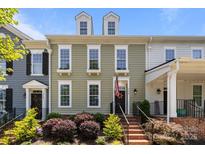 Charming townhome with a landscaped front yard, featuring classic architectural details and a welcoming entrance at 6438 Hove Rd, Mint Hill, NC 28227