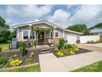 Charming single-story home with a well-manicured front yard and inviting front porch at 2206 Whitworth Rd, Cherryville, NC 28021