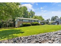 Charming two-story home with a well-manicured lawn and inviting front entrance at 3269 Tolley St, Claremont, NC 28610