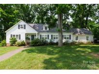 Charming single-story home with a well-manicured lawn, mature trees, and inviting curb appeal at 613 E Ridge St, Kings Mountain, NC 28086